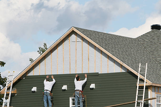 Professional Vinyl Siding technician working in Louisville, CO